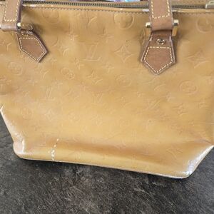 Gold Louis Vuitton handbag